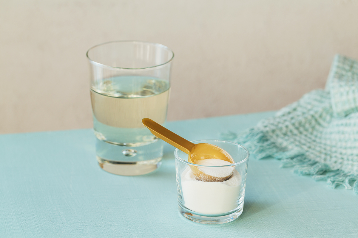 white powder and scoop in a glass