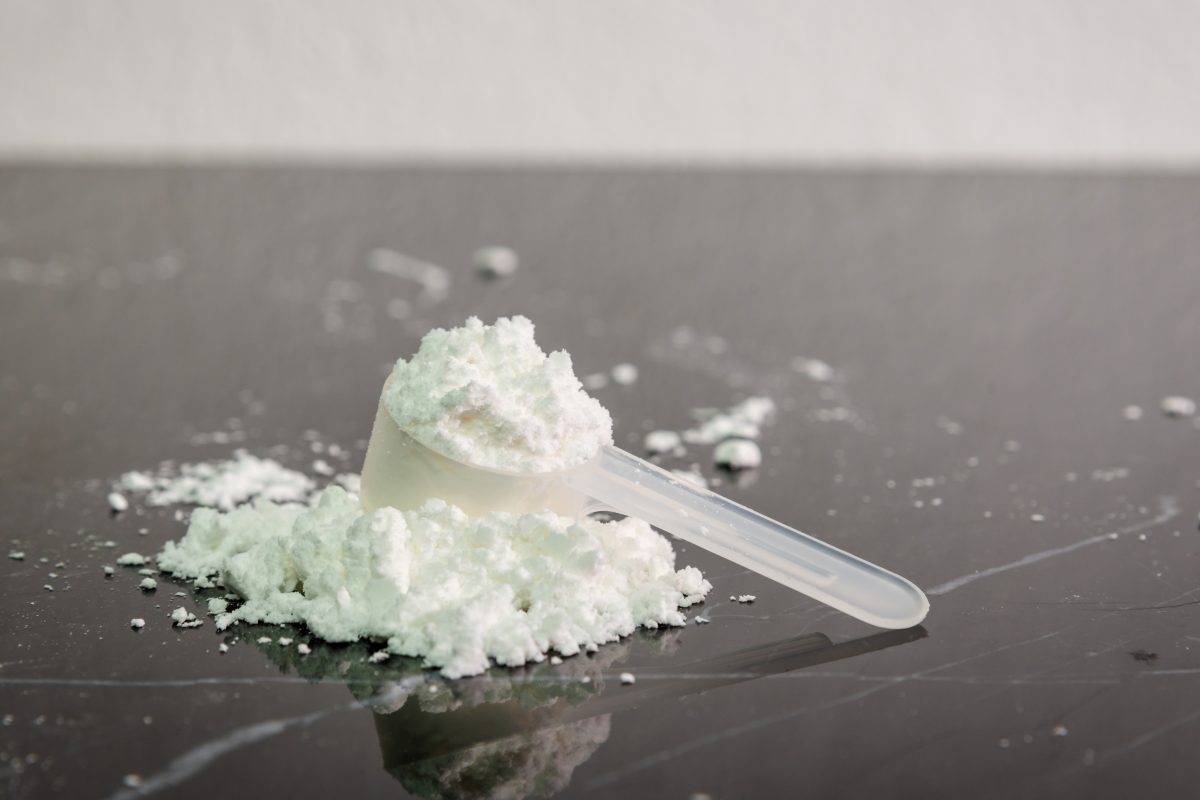 white powder in white transparent scoop