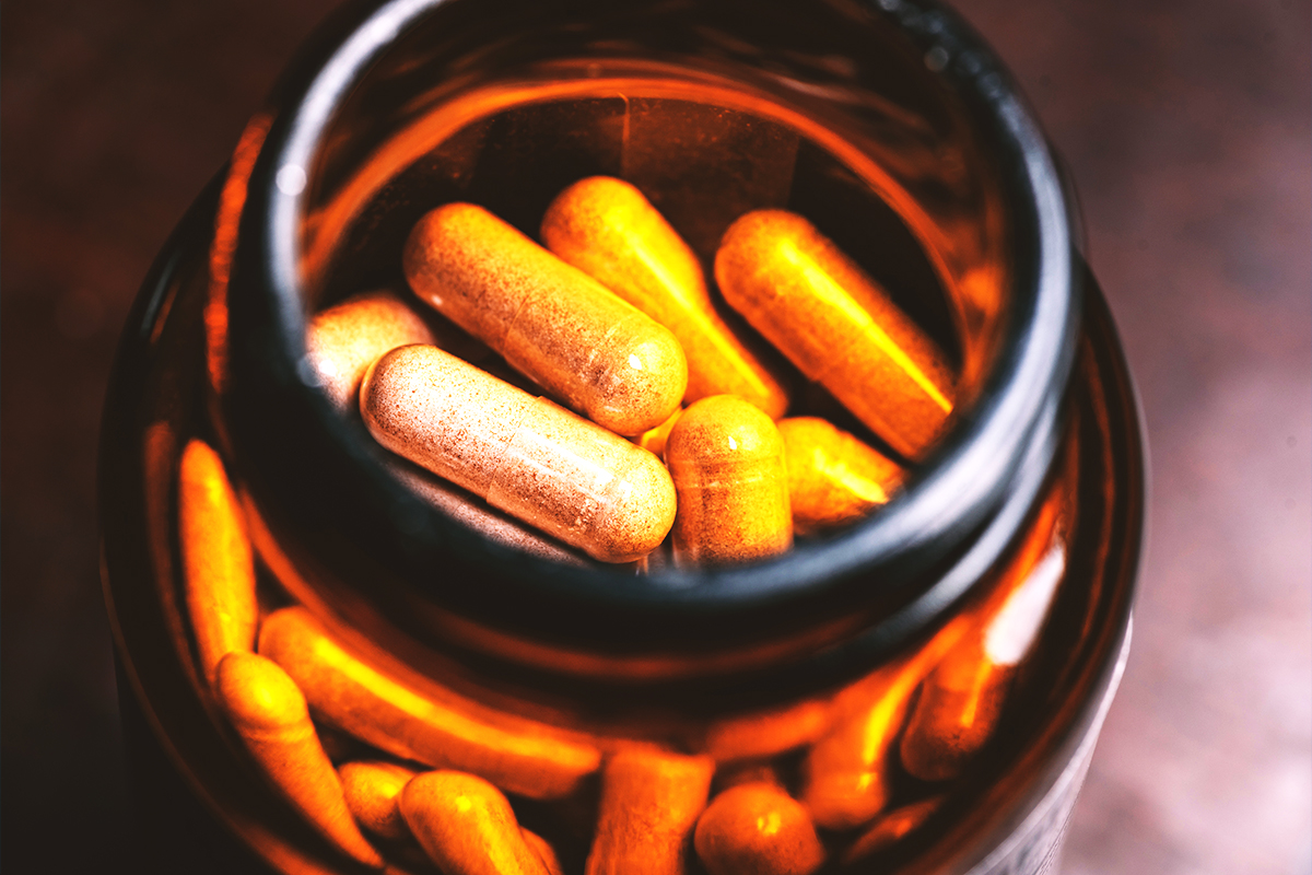close up shot of capsules in brown colored glass bottle