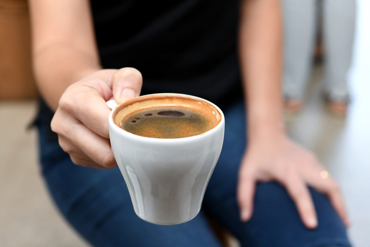 person holding cup of coffee